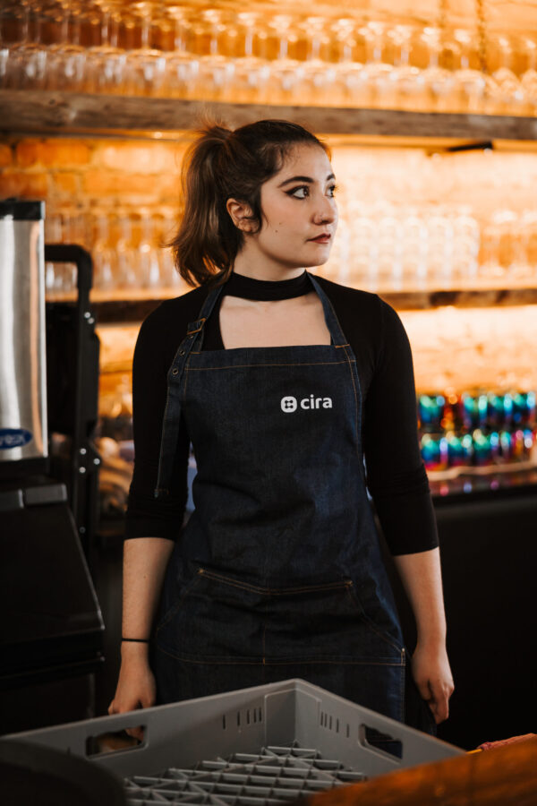 Bartender wearing a CIRA-embroidered apron