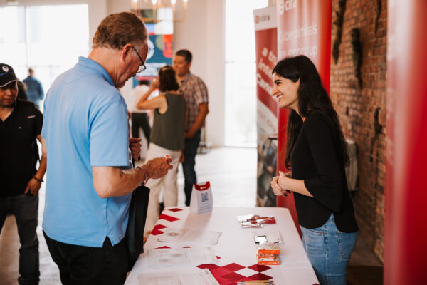 CIRA employee talking to an attendee at Canadians Connected: Edmonton