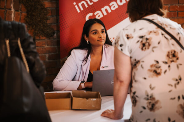 CIRA employee checking in attendees at Canadians Connected: Edmonton