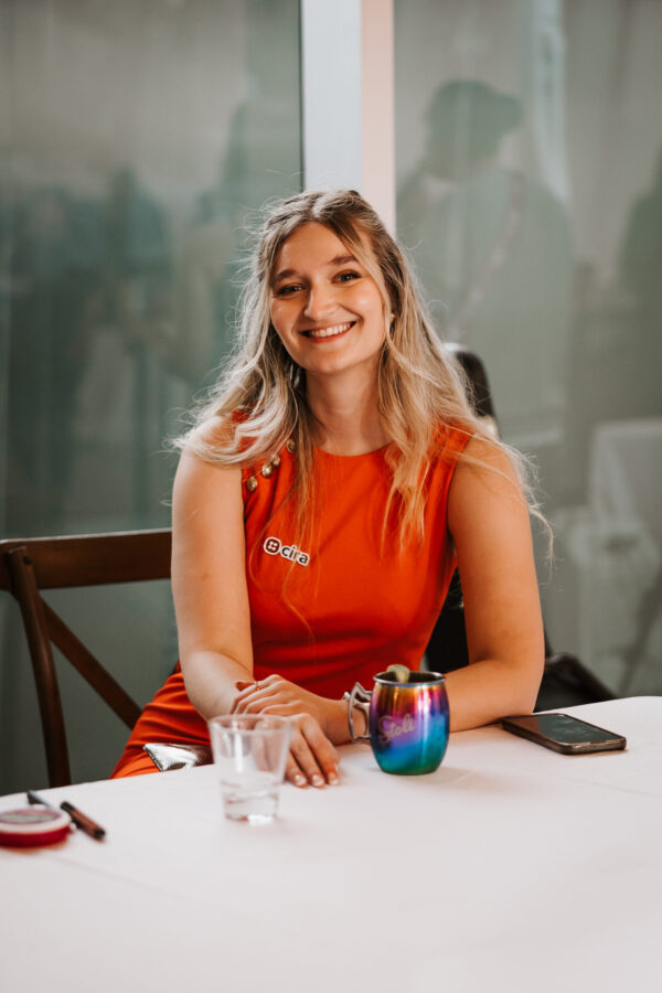 A CIRA employee sitting and smiling