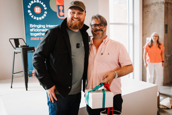 Attendee with a prize at Canadians: Connected