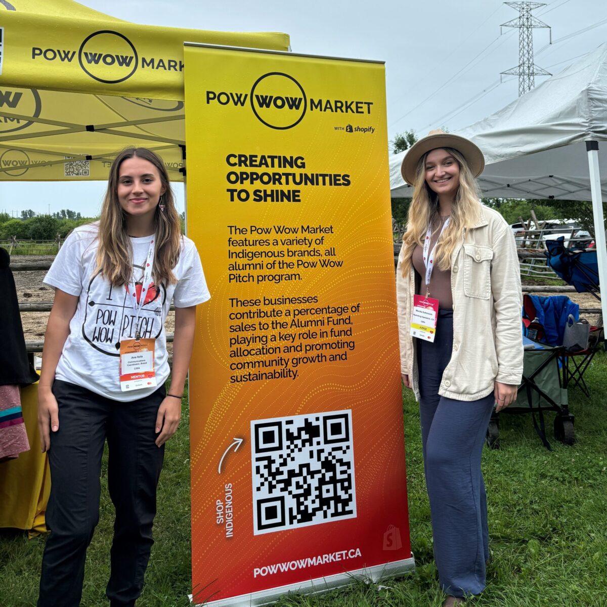 Ana Itoafa and Monika Sofrenovic in front of the Pow Wow Pitch banner