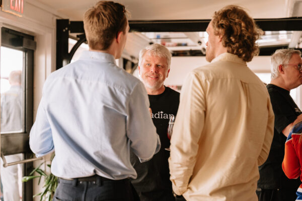 Three people having a conversation