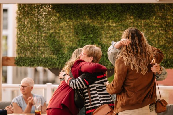 Two people hugging 