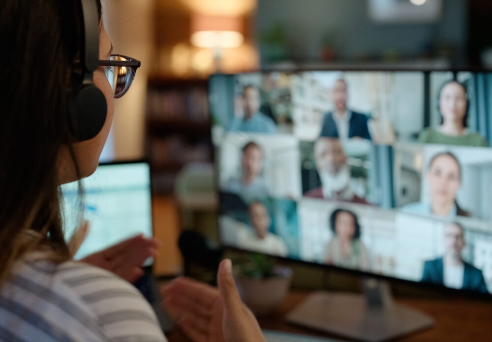 Woman, video call and conference or virtual meeting on screen discussion at home office, collage or webinar. female person, headphones and group diversity in london or presentation, talk or online