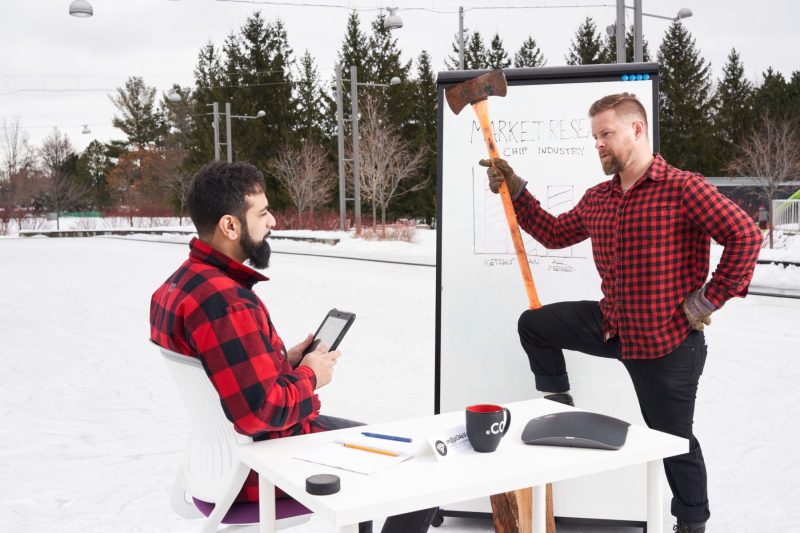Lumberjack colleagues discuss new marketing campaign